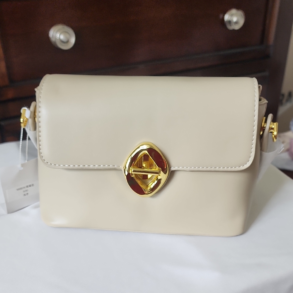 Elegant Cream Shoulder Bag with Gold Accent